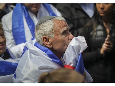 A unidentified man listens to a speaker at Place du Canada in Montreal Thursday, May 9, 2019 during Yom Ha'atzmaut celebrations marking the 71st Israel Independence Day.