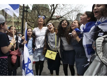 Students and volunteers from the Hebrew Academy in Côte-St-Luc school sing and dance at Place du Canada in Montreal Thursday, May 9, 2019 during Yom Ha'atzmaut celebrations marking the 71st Israel Independence Day.