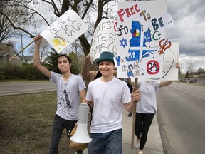 Alex O'Neill, holding megaphone, organized a school walkout protesting the proposed Bill 21 in Pointe-Claire last week.