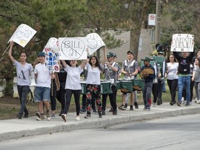 Student of St. Thomas High School march against the Quebec governments bill 21, along the western side St. John's Blvd in Pointe Claire Tuesday, May 7, 2019. Students from John Rennie High School and Lindsay Place also marched on the eastern side of the boulevard at the same time.
