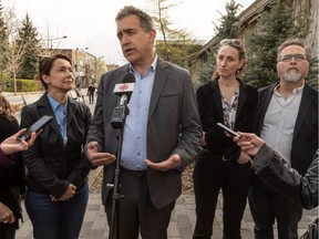 City councillor Alex Norris, named the interim mayor of the Plateau-Mont-Royal borough, speaks to reporters in Montreal on Wednesday May 15, 2019, with (from left) borough councillor Marie Plourde, city councillor Marianne Giguère and city councillor Richard Ryan.