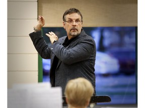 Music director Richard Stoelzel puts the Lakeshore Concert Band through its paces during a recent rehearsal.