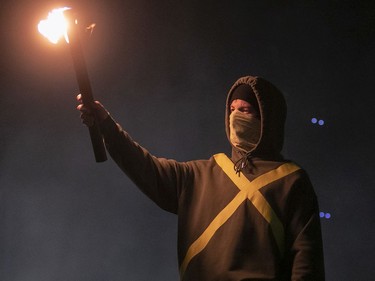 Drummer Josh Dun of Twenty One Pilots opens the show with a flaming torch at the Bell Centre on May 22, 2019