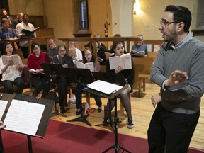 Roï Azoulay leads the St. Matthias and Shaar Hashomayim choirs in rehearsal for Wednesday's tribute to the music of Leonard Bernstein. "By far the most important thing we can do today is to reach out to our neighbours and do something together," says Azoulay, director of the Shaar choir.