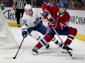 Canadiens winger Jonathan Drouin tries to shake off Leafs defenceman Jake Gardiner last season. Gardiner, who is a free agent, would fill a big hole of the left side of the Habs defence, Brendan Kelly writes.