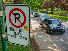 Parking signs in Outremont on Thursday May 30, 2019.