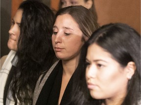 Marie-Michele Benjamin, centre, leaves the after a sentencing hearing in October 2018.