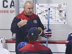 Canadiens head coach Michel Therrien talks with his team during practice at the Bell Sports Complex in Brossard on Nov. 1, 2016.