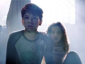 This image released by Warner Bros. Pictures shows Roman Christou, left, and Jaynee-Lynne Kinchen in a scene from "The Curse of La Llorona."
