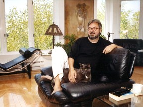 Michel Tremblay, at home with his cat Marco, is helping stage Yiddish play. Photo used May 23, 1992.