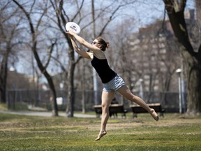 Avery Shoemaker she jumps for a frisbee during a warm sunny afternoon in Montreal on May 6. Montrealers don't have much summer, so take advantage whenever it gets warm here, Allison Hanes writes.