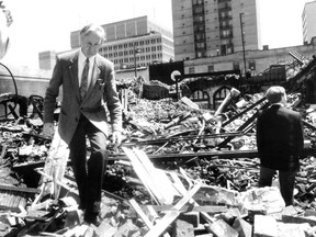 In this photo published May 27, 1987, Rev. Charles Eddis picks his way through the wreckage of the Unitarian Church of Montreal, which had been destroyed May 25 by a deliberately set fire.