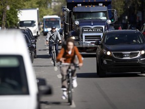 Cyclists ride north on St-Denis St. in Montreal, on Monday, May 27, 2019.