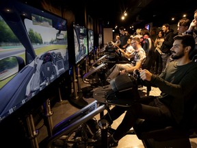 Hugo Belanger tries his hand at a racing simulator at Esports Central in Montreal  May 30, 2019.