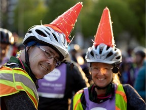 The Poirier family of Ottawa sport light up construction cones during the Tour la Nuit in Montreal May 31, 2019.  Montreal psychiatrist Norman Hoffman, says tongue-in-cheek "There has been a large increase in anxiety and fear of construction cones, a condition naturally called Orange Coneaphobia."