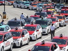 Taxis line up for fares at Trudeau airport in 2018.