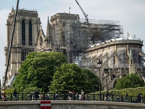 A picture taken on May 10, 2019 in Paris shows Notre-Dame de Paris cathedral as construction work is ongoing to secure the site that was badly damaged by a huge fire last April 15, on May 10, 2019.