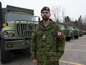 Combat Engineer Warrant Andrew Buchan poses for a photo outside a staging location Wednesday May 1, 2019 in Ottawa.
