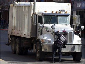 Montreal police check the angle of the safety mirrors on a garbage truck in 2010.