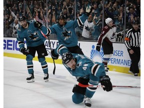 San Jose Sharks' Joonas Donskoi, left, and Evander Kane celebrate a goal by Tomas Hertl (48) during the third period of Game 5 of the team's NHL hockey second-round playoff series against the Colorado Avalanche on Saturday, May 4, 2019, in San Jose, Calif.