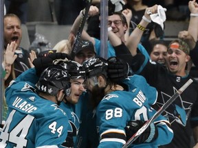 San Jose Sharks' Marc-Edouard Vlasic (44), Timo Meier (28) and Brent Burns (88) celebrate a goal by Meier against the St. Louis Blues in the second period in Game 1 of the NHL hockey Stanley Cup Western Conference finals in San Jose, Calif., Saturday, May 11, 2019.