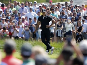 Brooks Koepka waits to putt on the first green during the third round of the PGA Championship golf tournament, Saturday, May 18, 2019, at Bethpage Black in Farmingdale, N.Y.