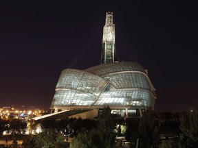 A night view of the Canadian Museum For Human Rights is shown in Winnipeg on September 16, 2014. The Quebec government's latest attempt to legislate on secularism could find its way into the Canadian Museum for Human Rights in Winnipeg. The Legault government's Bill 21 would prohibit public servants in positions of authority -- including teachers, police officers, Crown prosecutors and prison guards -- from wearing religious symbols on the job, and the Coalition Avenir Quebec government intends to see it passed into law within a month. The museum, which has exhibits exploring issues that include freedom of religion and conscience, said it is planning to refresh its exhibit on Quebec's attempts to deal with secularism.