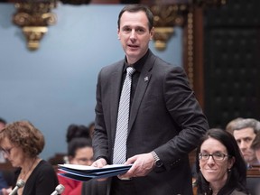 Quebec Education Minister Jean-Francois Roberge tables a document before question period Tuesday, December 4, 2018 at the legislature in Quebec City. Quebec's education minister called out a Montreal school Tuesday for its reported practice of locking panicking autistic children into a small and unsafe closet to calm them down.