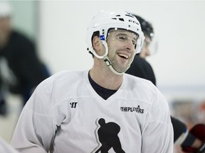 Former Canadiens forward Mathieu Darche smiles during a skating session with Canadiens players at Les 2 Glaces sporting centre in Candiac, south of Montreal, on Monday, January 7, 2013.