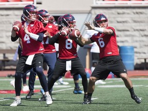 Montreal Alouettes quarterbacks Jeff Mathews (4) and Hugo Richard (6) take part in a drill during training camp in Montreal, Monday, May 20, 2019.