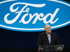 FILE - In this Jan. 14, 2018, file photo Ford President and CEO Jim Hackett prepares to address the media at the North American International Auto Show in Detroit.