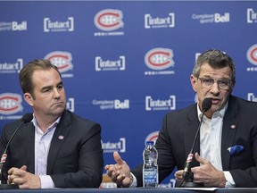 Montreal Canadiens owner Geoff Molson, left, looks on as general manager Marc Bergevin speaks to reporters during an end of season news conference in Brossard on April 9, 2018.