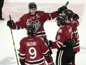 Guelph Storm Nick Suzuki, Isaac Ratcliffe, Sean Durzi and Jack Hanley, left to right, celebrate Durzi's goal against the Halifax Mooseheads in first period 2019 Memorial Cup action in Halifax on Sunday, May 19, 2019.