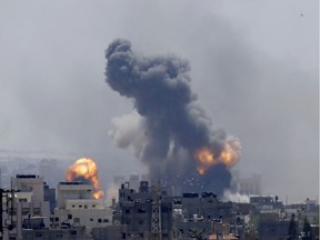 Smoke rises from an explosion caused by an Israeli airstrike in Gaza City, Saturday, May 4, 2019.  Palestinian militants in the Gaza Strip fired at least 90 rockets into southern Israel on Saturday, according to the Israeli military, triggering retaliatory airstrikes and tank fire against militant targets in the blockaded enclave and shattering a month-long lull in violence.