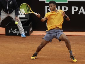 Montreal's Felix Auger-Aliassime returns the ball to Croatia's Borna Coric during their match at the Italian Open in Rome on May, 13, 2019.