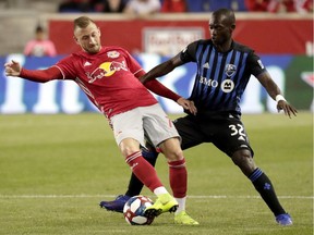Montreal Impact midfielder Micheal Azira, right, battles New York Red Bulls' Daniel Royer during second half on May 8, 2019, in Harrison, N.J. The Impact won 2-1.