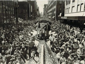May 16, 1977, Stanley Cup victory parade: Montreal Canadiens captains Serge Savard and Yvan Cournoyer flank the Stanley Cup as Montrealers line the streets to pay tribute to the championship team.