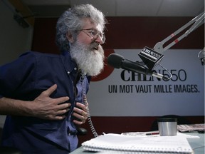 Pierre Mailloux speaks into a microphone in a radio studio