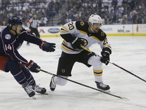 Boston Bruins' Joakim Nordstrom, right, of Sweden, carries the puck upice as Columbus Blue Jackets' Dean Kukan, of Switzerland, defends during the first period of Game 6 of an NHL hockey second-round playoff series Monday, May 6, 2019, in Columbus, Ohio.