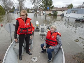 Governor-General of Canada Julie Payette, left, and Mayor Sonia Paulus visit the flood zone Thursday, May 2, 2019 in Ste-Marthe-sur-le-Lac, a week after the dike there burst.