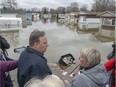 Quebec Premier François Legault and Mayor Sonia Paulus visit the flood zone Thursday in Ste-Marthe-sur-le-Lac, nearly a week after a dike there broke and forced an estimated 6,500 from their homes.