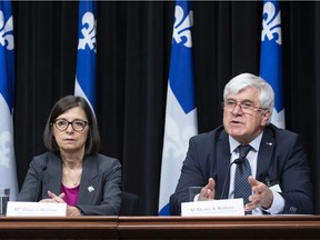 "Are there some doctors who are too strict in the application of the criteria? We have observed this (attitude) in several cases," says Dr. Michel Bureau, seen responding to reporters' questions at a news conference April 3, 2019 at the legislature in Quebec City while Health and Social Services Minister Danielle McCann looks on.