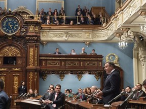 Quebec Premier Francois Legault, right, speaks during the inaugural speech, Wednesday, November 28, 2018 at the legislature in Quebec City.