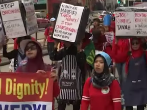 Screen shot from Associated Press video about May Day marches and skirmishes around the world.