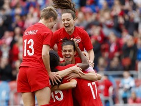 Team Canada captain Christine Sinclair (12) celebrates a goal by midfielder Jessie Fleming (17) with teammates Allysha Chapman (2) and Sophie Schmidt (13) during the first half of a women's international soccer friendly against Mexico at BMO field in Toronto, Saturday, May 18, 2019.