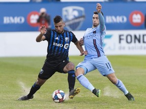 Montreal Impact's Saphir Taider, left, challenges New York FC's Valentin Castellanos during second half MLS soccer action in Montreal on Saturday, May 4, 2019.