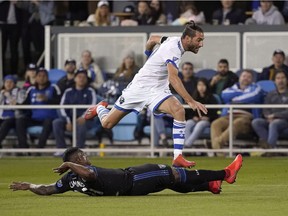 Montreal Impact midfielder Ignacio Piatti (10) leaps over San Jose Earthquakes defender Harold Cummings (31) during the second half of an MLS soccer match in San Jose, Calif., Saturday, March 2, 2019.