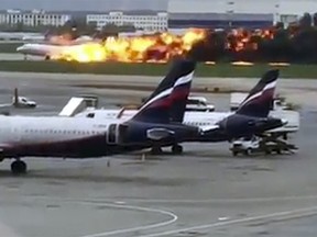 This image taken from video provided by Instagram user @artempetrovich, shows the SSJ-100 aircraft of Aeroflot Airlines on fire during an emergency landing in Sheremetyevo airport in Moscow.