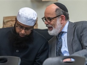 Disappointed that the government is cutting off debate on Bill 21, An Act Respecting the Laicity of the State, and severely restricting the number of individuals and organizations invited to meet with the commission, Coalition Inclusion Quebec hosted the People's Hearings. Imam Musabbir Alam, co-founder of the Canadian Muslim Alliance, and lawyer Gregory Bordan, left to right, chat prior to the start of the hearings in Montreal on Monday May 13, 2019.