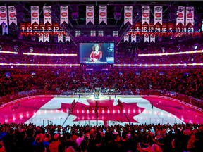 The Canadian flag is projected onto the ice at the Bell Centre during singing of the national anthem before NHL game between the Canadiens and Florida Panthers in Montreal on Jan. 15, 2019.